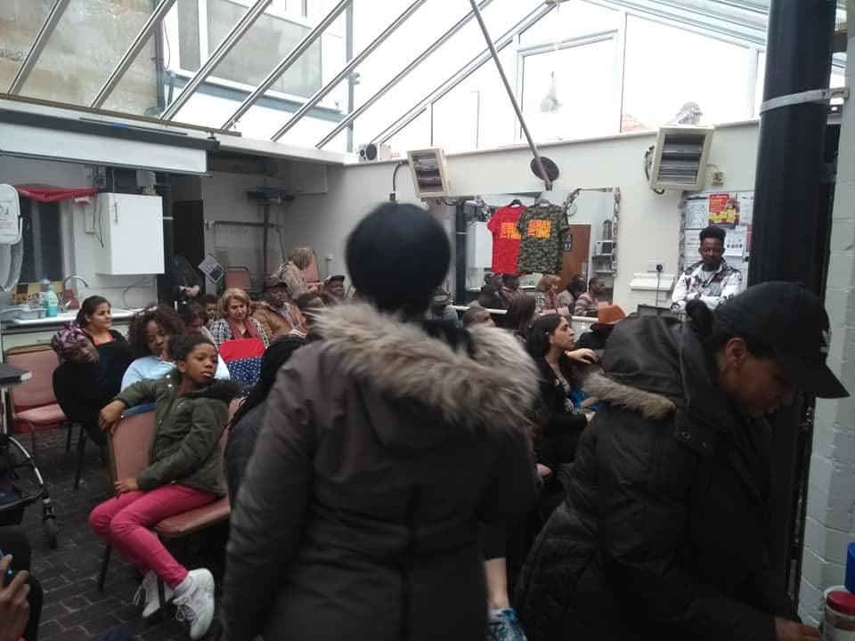 Young people laughing and cheering together at a community event