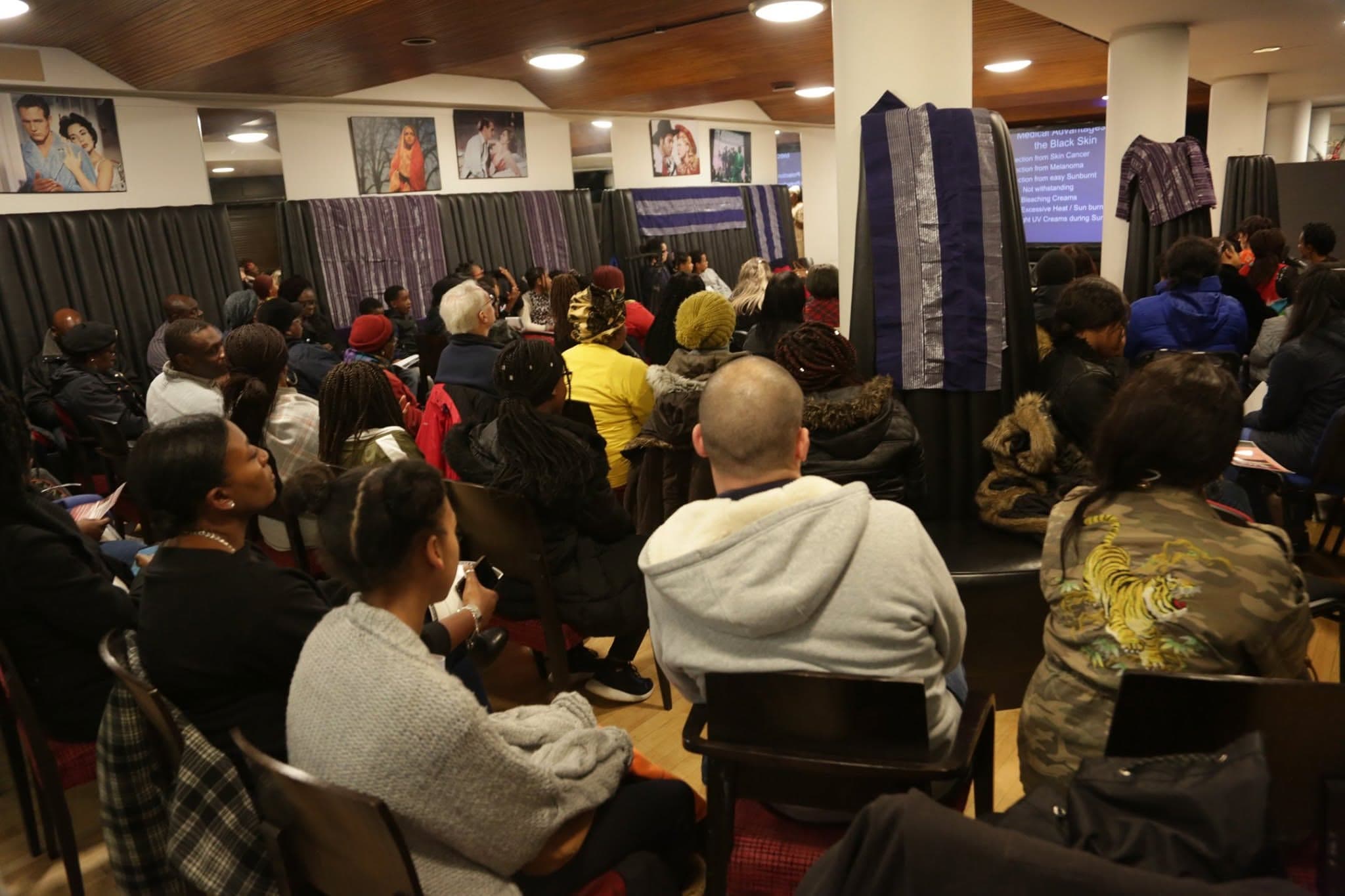 Community members attending a health awareness talk
