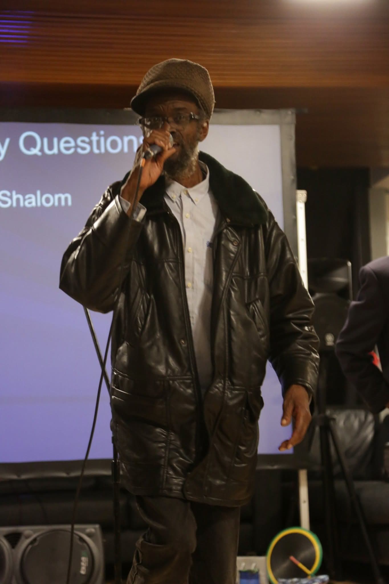 A guest speaker addressing attendees at a community event