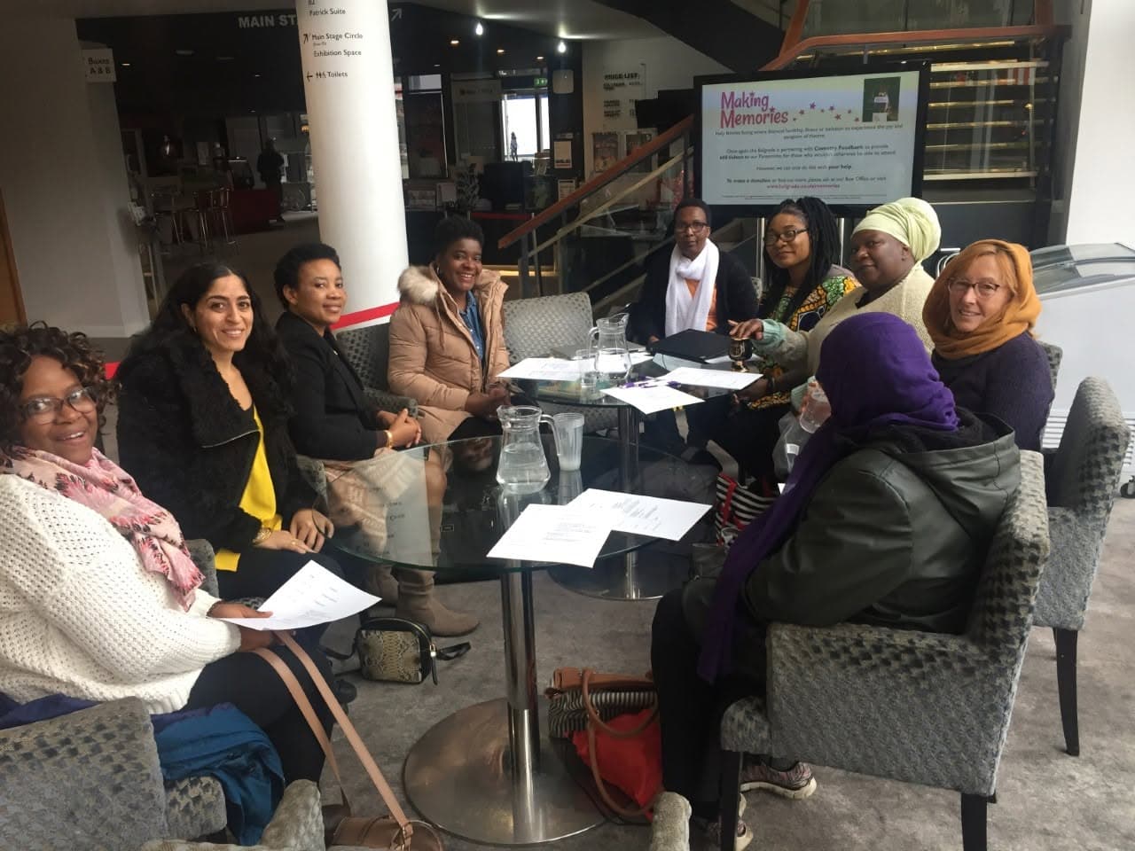 A women's support group meeting together around a table